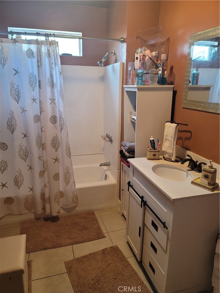 1408 South Burris Avenue Compton, CA 90221 - Photo 9 of 29 a bathroom with a sink a toilet and shower