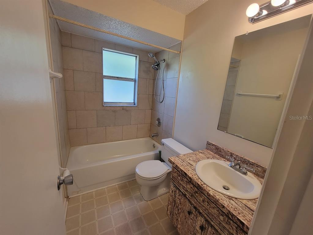 23358 Racine Avenue Punta Gorda, FL 33980 - Photo 20 of 28 a bathroom with a sink toilet and shower