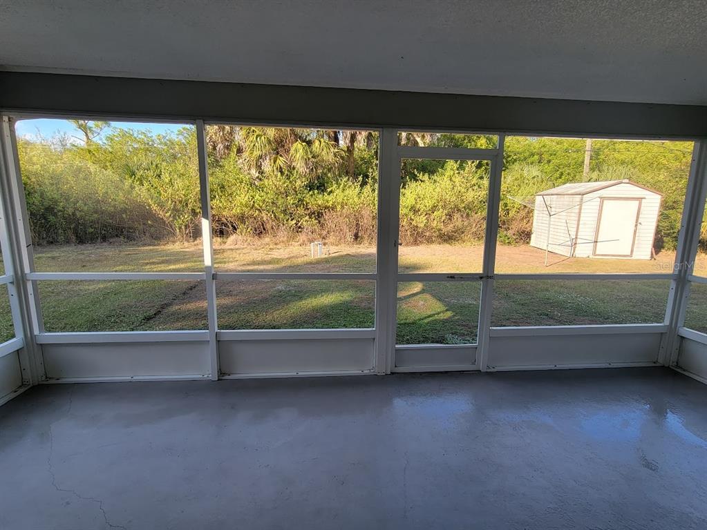 23358 Racine Avenue Punta Gorda, FL 33980 - Photo 21 of 28 a view of a floor to ceiling window in an empty room