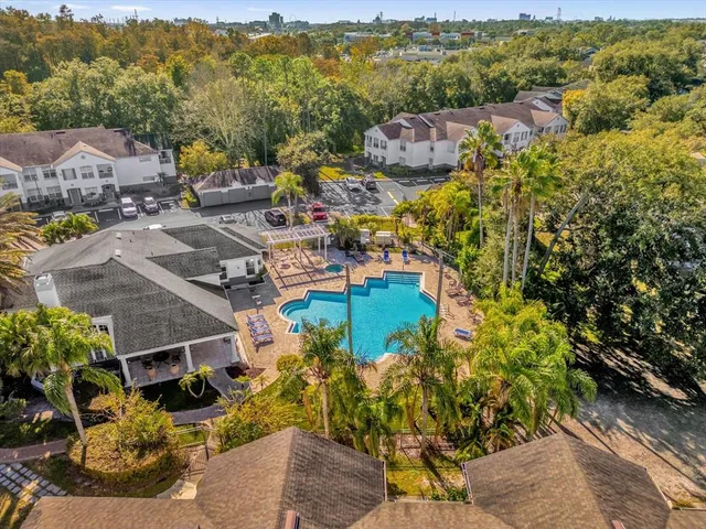 an aerial view of residential houses with outdoor space