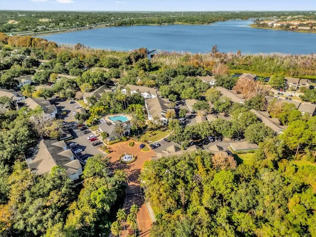 a view of a lake with houses in the back