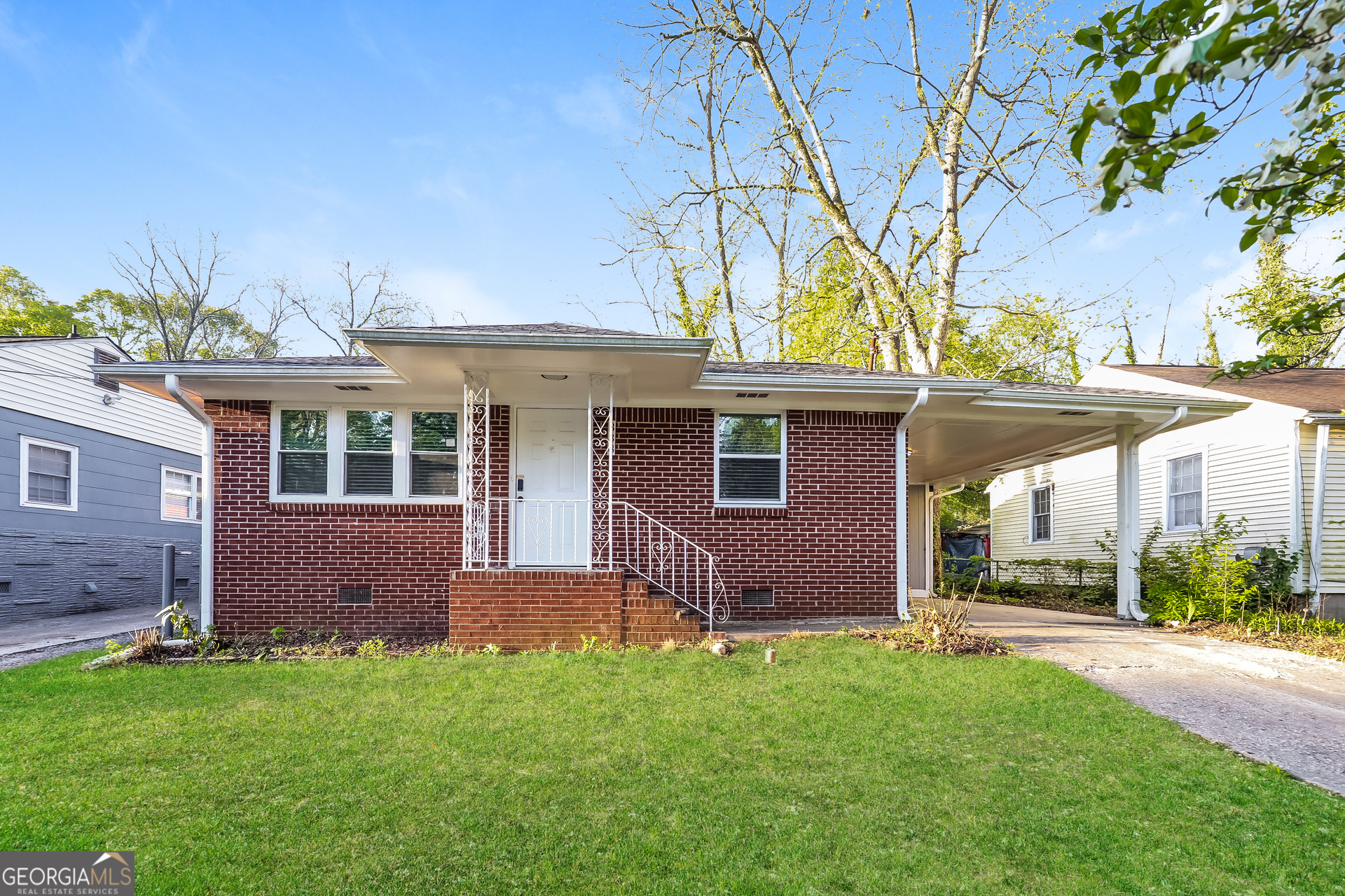 338 Mount Zion Road Southwest Hapeville, GA 30354 - Photo 1 of 1 front view of house with a yard