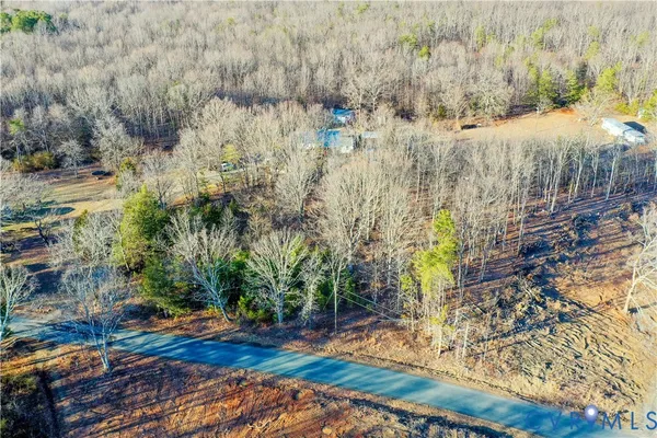 a view of a yard with an outdoor seating