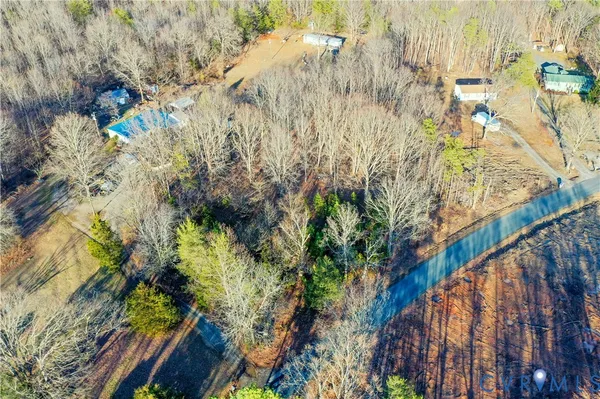 a view of a yard with wooden fence