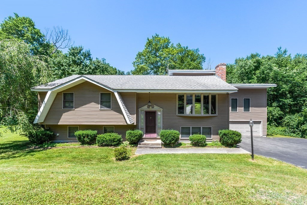 96 Fowler Road Northbridge, MA 01534 - Photo 2 of 28 a front view of a house with yard and green space