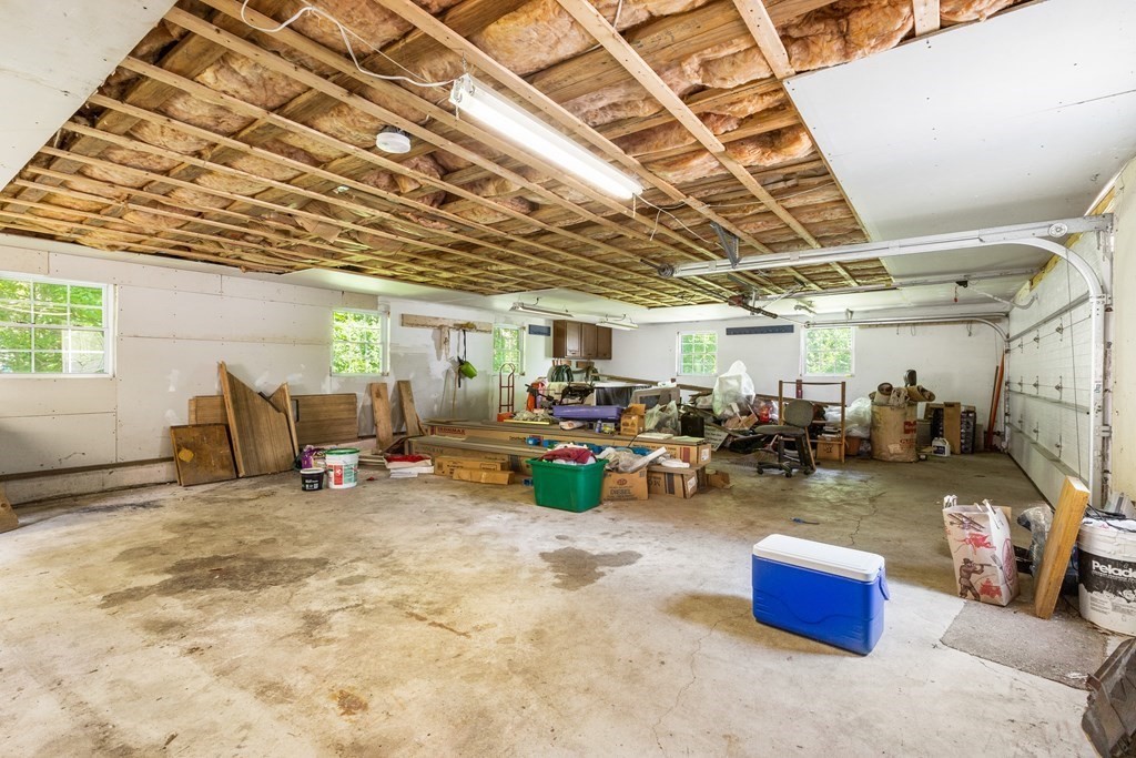 96 Fowler Road Northbridge, MA 01534 - Photo 22 of 28 a view of a garage with a table and chairs