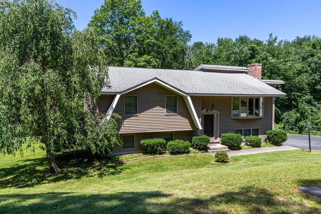 96 Fowler Road Northbridge, MA 01534 - Photo 25 of 28 a front view of a house with a yard