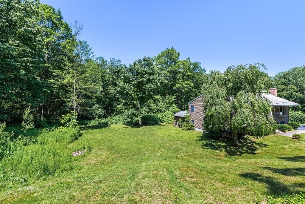 96 Fowler Road Northbridge, MA 01534 - Photo 26 of 28 a view of a garden with a building in the background