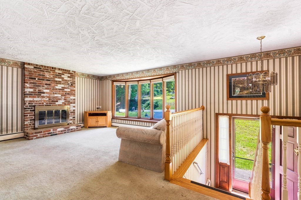 96 Fowler Road Northbridge, MA 01534 - Photo 3 of 28 a living room with furniture and a floor to ceiling window