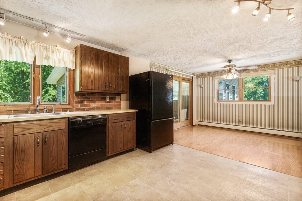 96 Fowler Road Northbridge, MA 01534 - Photo 7 of 28 a kitchen with a refrigerator and a sink