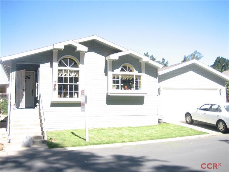 4750 South Blosser Road, Unit 318 Santa Maria, CA 93455 - Photo 1 of 17 a front view of a house with a yard