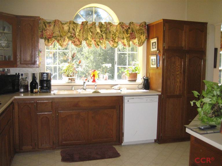 4750 South Blosser Road, Unit 318 Santa Maria, CA 93455 - Photo 11 of 17 a kitchen with a sink cabinets and a window