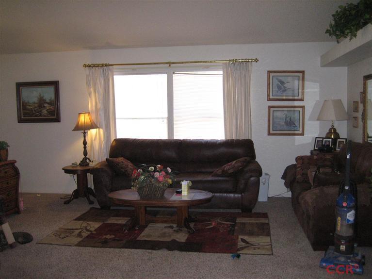 4750 South Blosser Road, Unit 318 Santa Maria, CA 93455 - Photo 12 of 17 a living room with furniture and a window