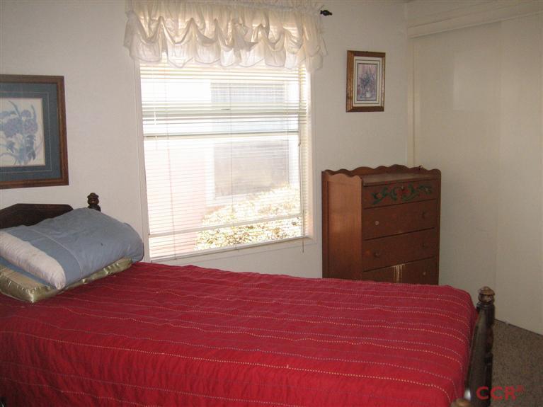 4750 South Blosser Road, Unit 318 Santa Maria, CA 93455 - Photo 13 of 17 a bedroom with a bed and a window