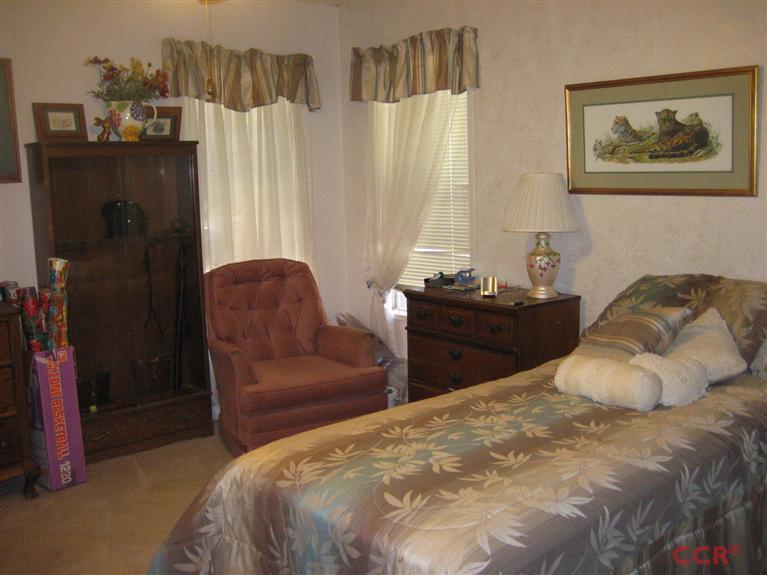 4750 South Blosser Road, Unit 318 Santa Maria, CA 93455 - Photo 16 of 17 a bedroom with a bed and a couch