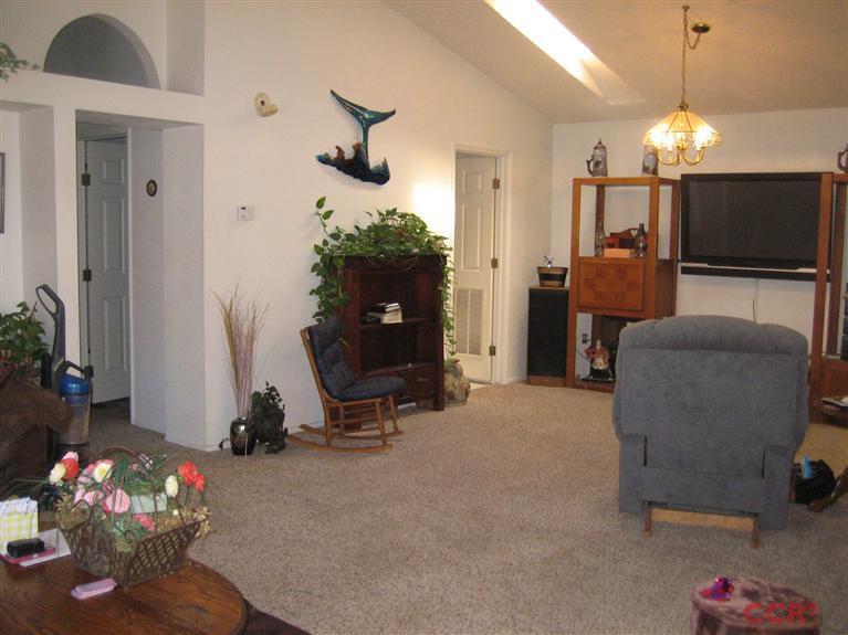 4750 South Blosser Road, Unit 318 Santa Maria, CA 93455 - Photo 7 of 17 a room with furniture and a flat screen tv