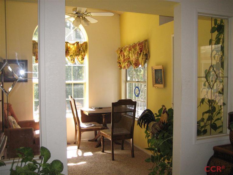4750 South Blosser Road, Unit 318 Santa Maria, CA 93455 - Photo 8 of 17 a dining room with furniture and a window