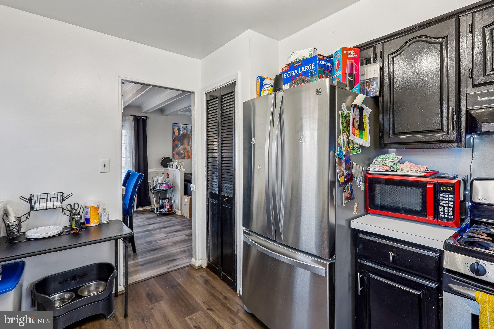 3723 Eastman Road Randallstown, MD 21133 - Photo 12 of 36 a kitchen with stainless steel appliances granite countertop a refrigerator and a stove