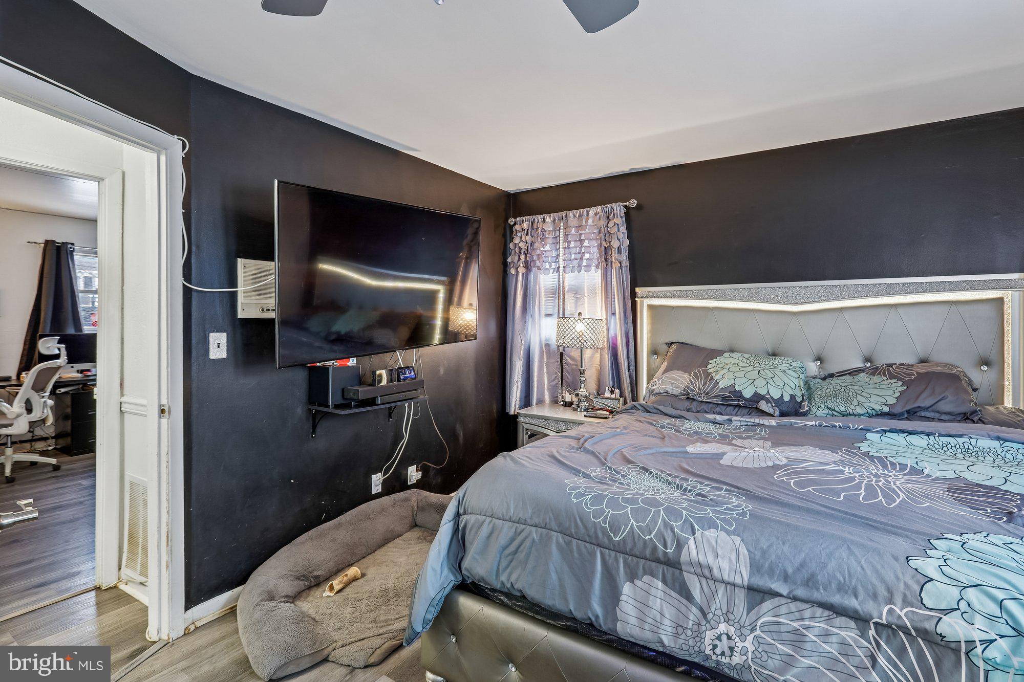 3723 Eastman Road Randallstown, MD 21133 - Photo 15 of 36 a bedroom with a bed and a flat screen tv