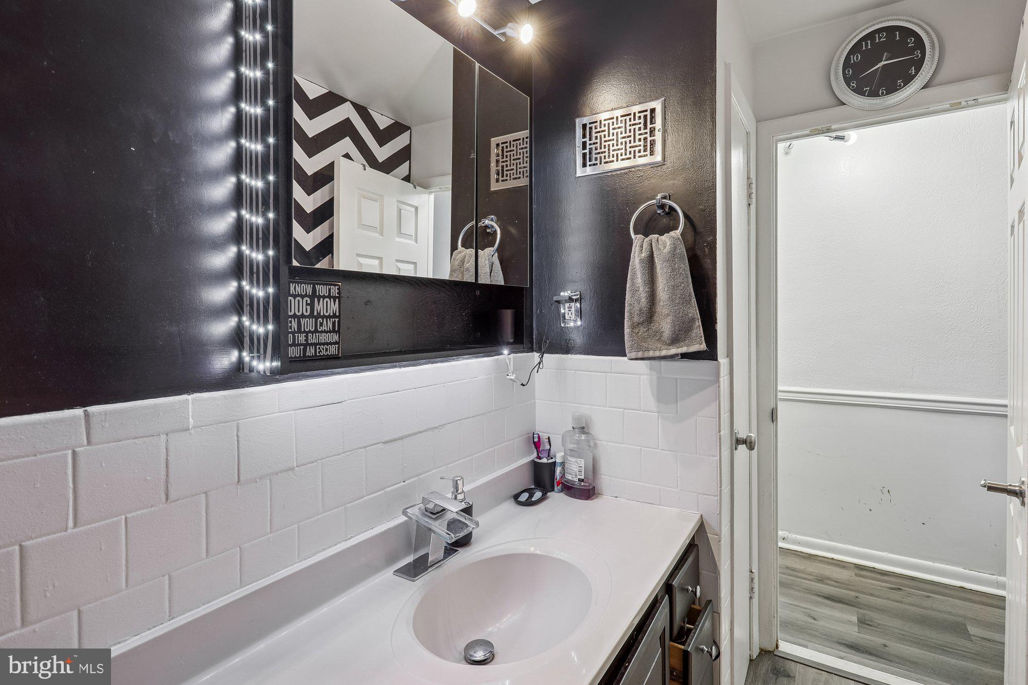 3723 Eastman Road Randallstown, MD 21133 - Photo 20 of 36 a bathroom with a sink and a mirror