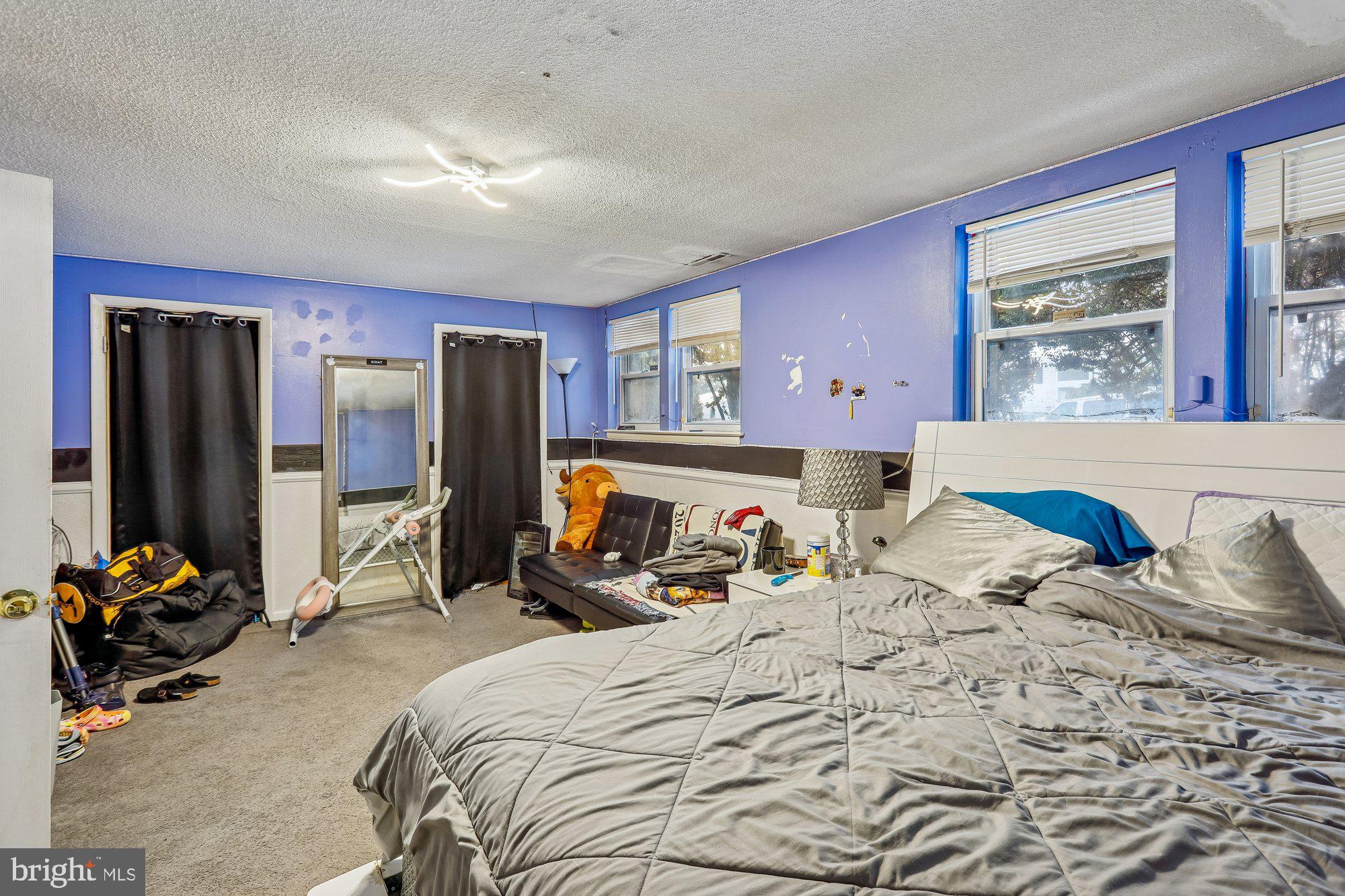 3723 Eastman Road Randallstown, MD 21133 - Photo 21 of 36 a bedroom with a bed and wooden floor
