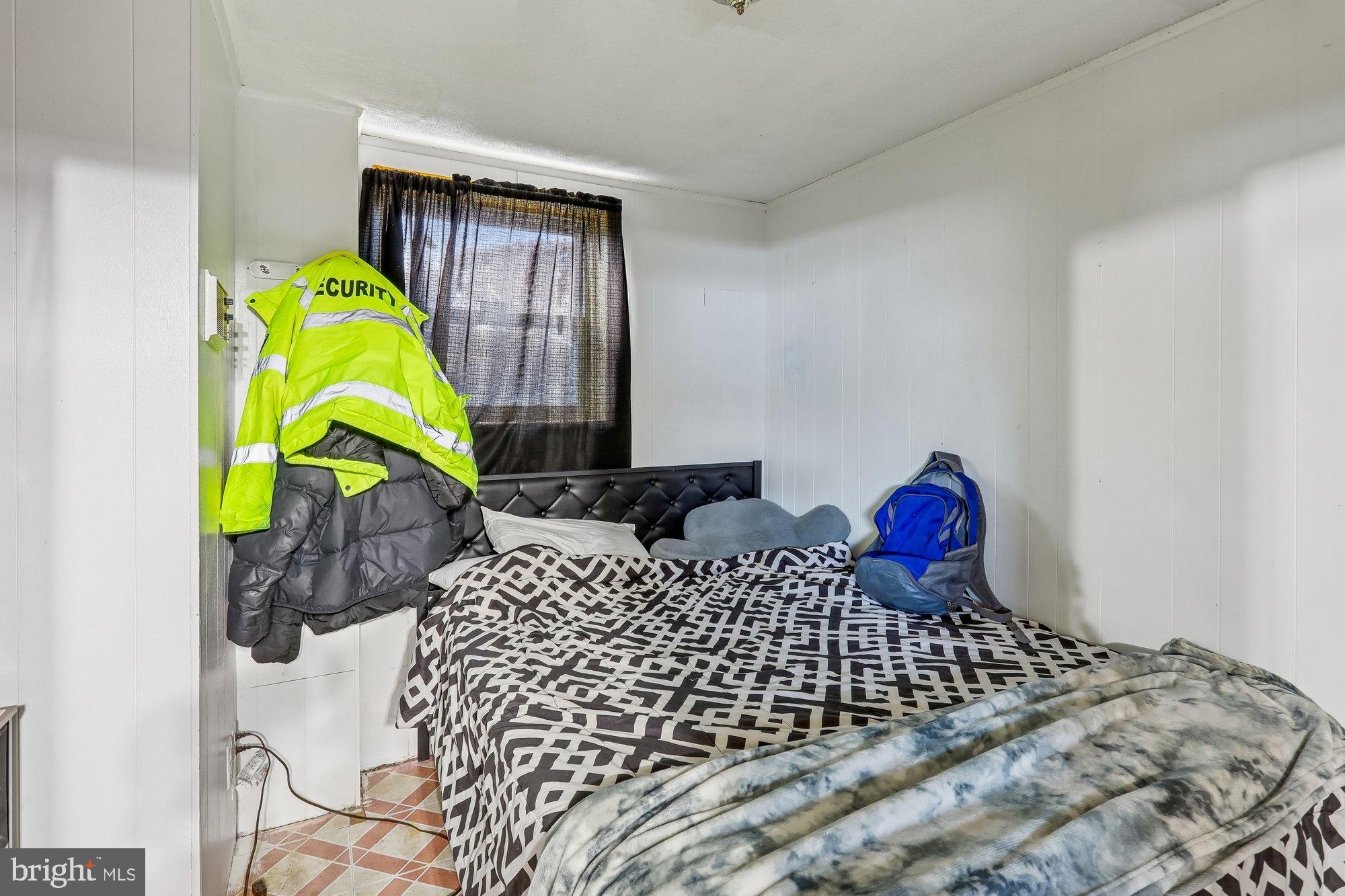 3723 Eastman Road Randallstown, MD 21133 - Photo 26 of 36 a bedroom with bed and a window