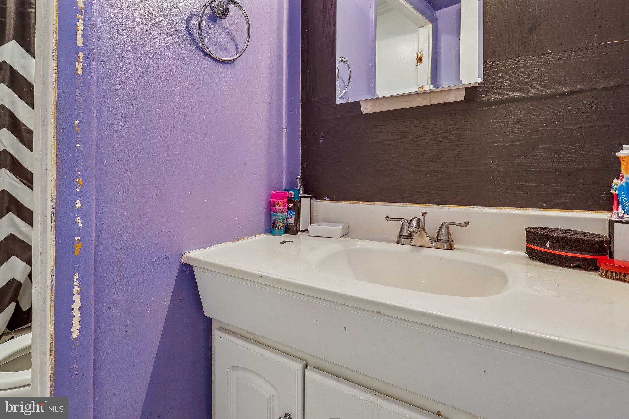 3723 Eastman Road Randallstown, MD 21133 - Photo 28 of 36 a bathroom with a sink and a mirror