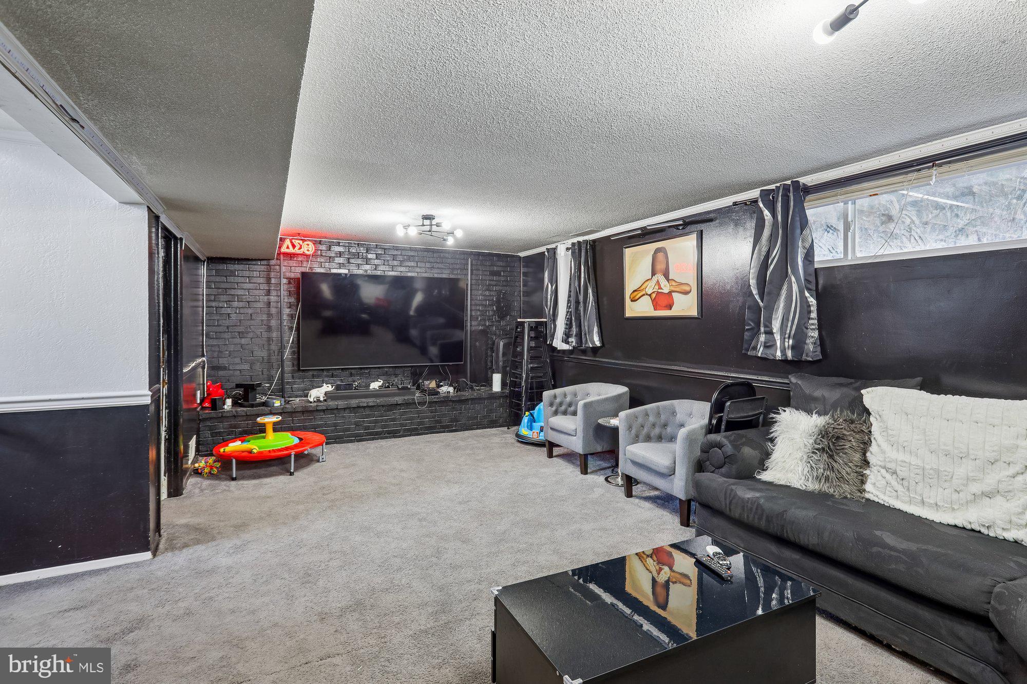 3723 Eastman Road Randallstown, MD 21133 - Photo 30 of 36 a living room with furniture and flat screen tv