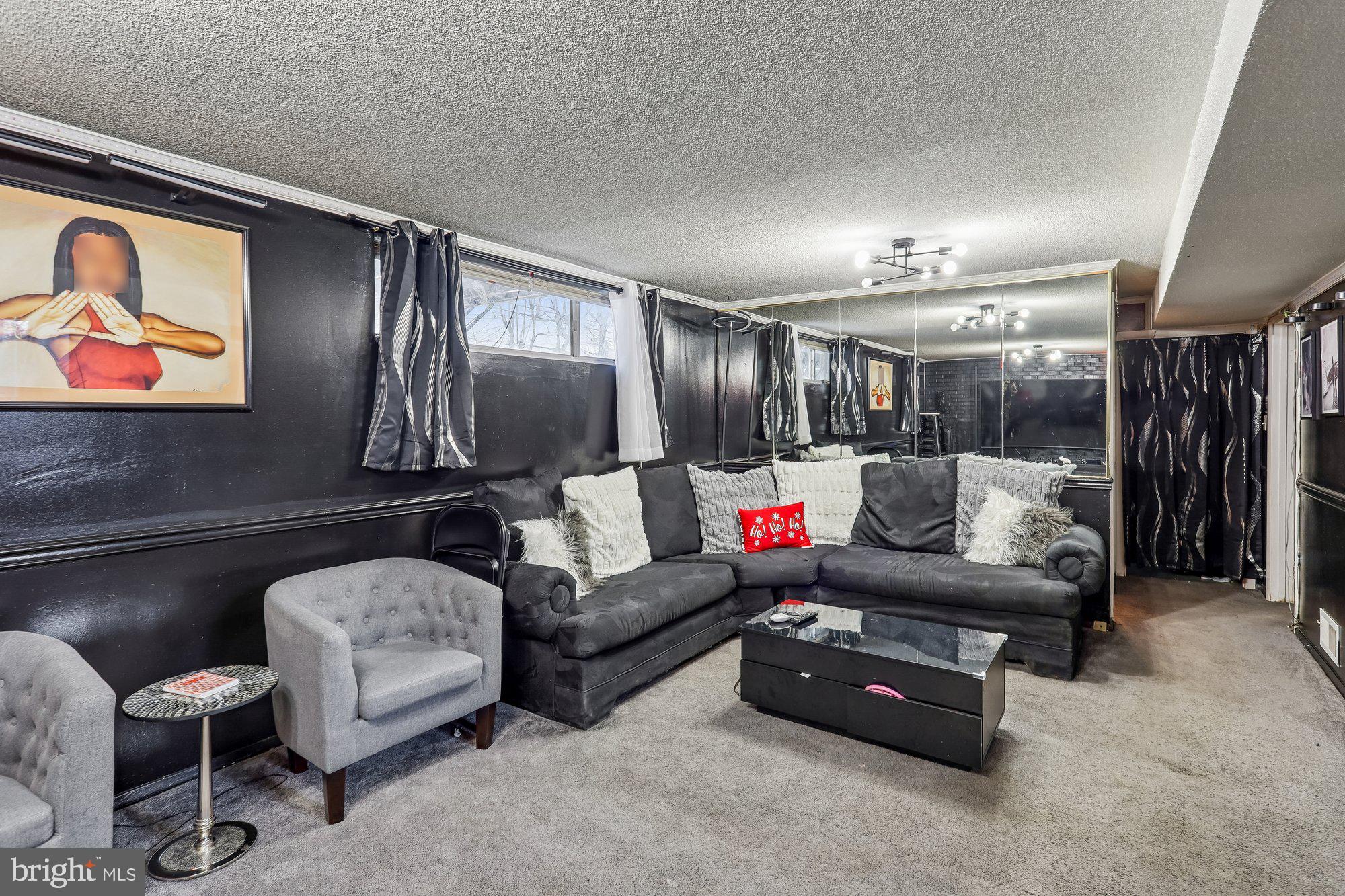 3723 Eastman Road Randallstown, MD 21133 - Photo 31 of 36 a living room with furniture and painting on the wall