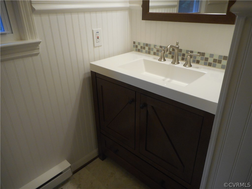 21469 Cabin Point Road Disputanta, VA 23842 - Photo 11 of 12 Bathroom showing new cabinet, sink, and faucets.