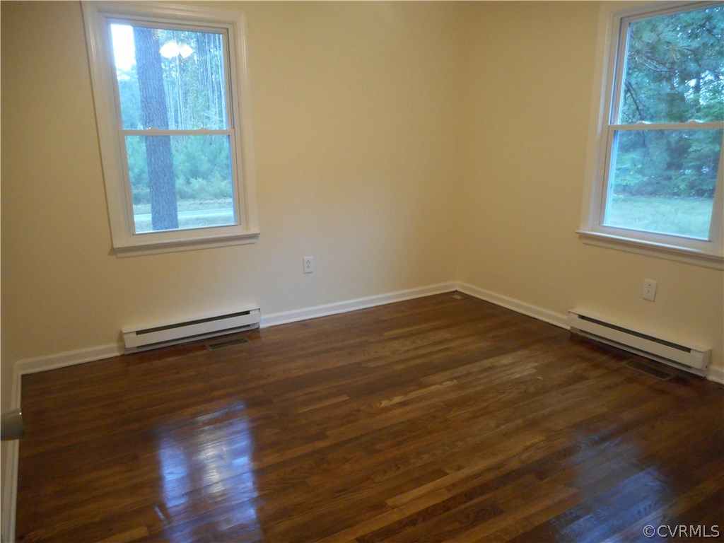 21469 Cabin Point Road Disputanta, VA 23842 - Photo 5 of 12 Another bedroom showing again the beautiful shiny