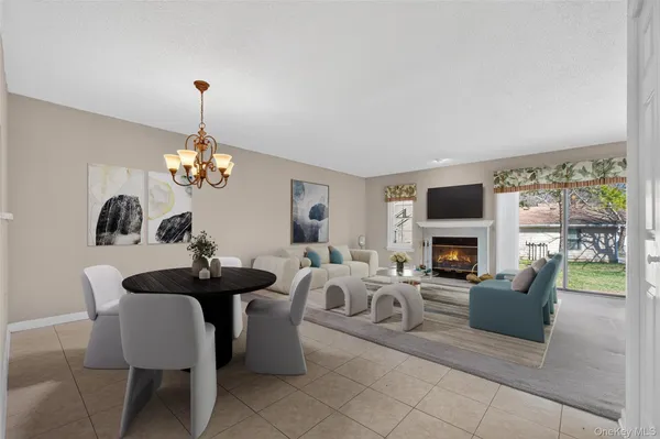 an empty room with fireplace and windows