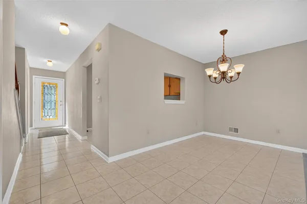 a view of a room with white walls
