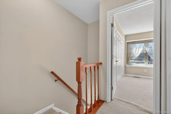 a view of entryway with stairs and a window