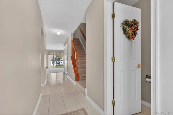 a view of a hallway with a window and a mirror
