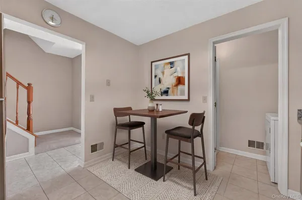 a view of a livingroom with furniture and dining area