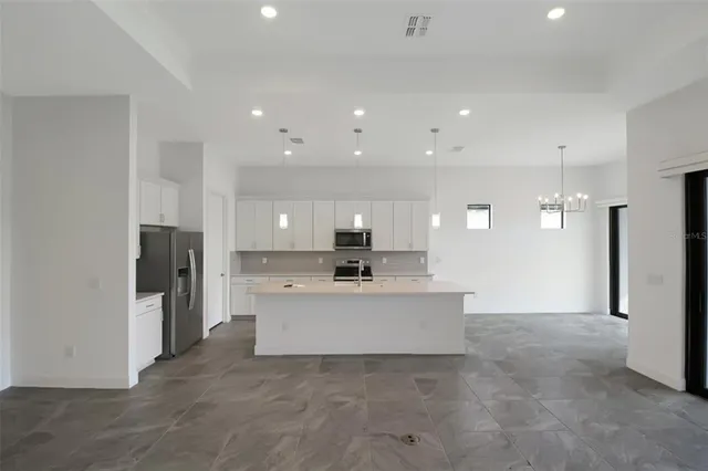 a view of a kitchen with a sink