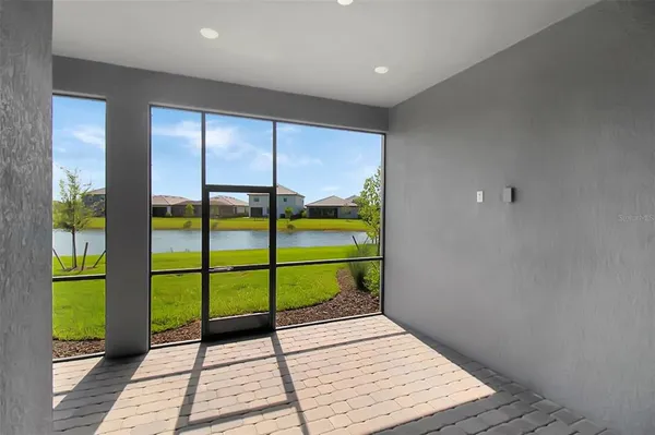 a view of a swimming pool with a patio