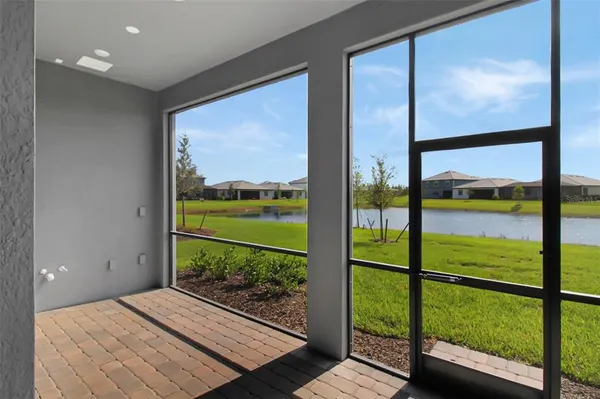 a view of a backyard with sitting area