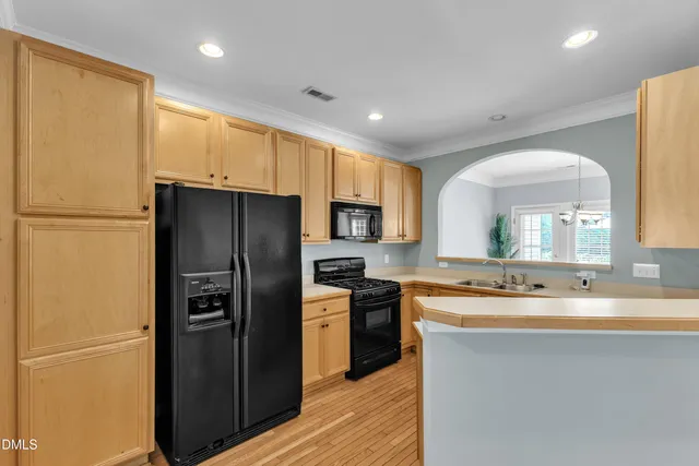 a view of a kitchen from the hallway