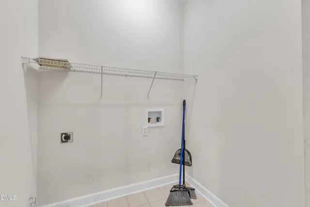 a kitchen with stainless steel appliances granite countertop white cabinets and a stove top oven