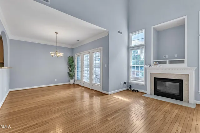 a view of a room with wooden floor