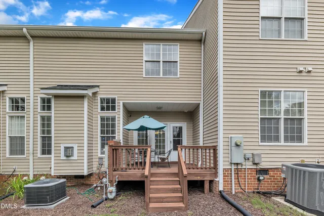 an empty room with a window and ceiling fan