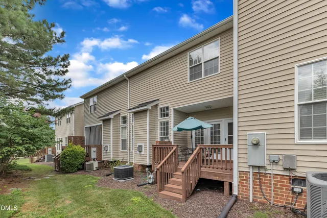 a front view of a house with sitting area