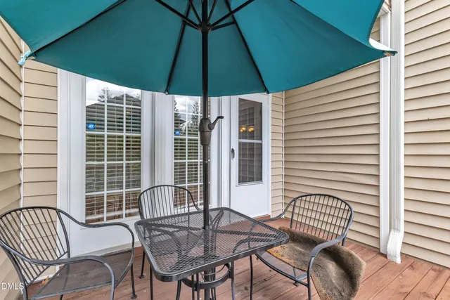 a view of a house with a yard and furniture