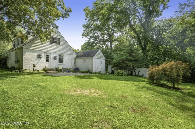 a house view with a garden space