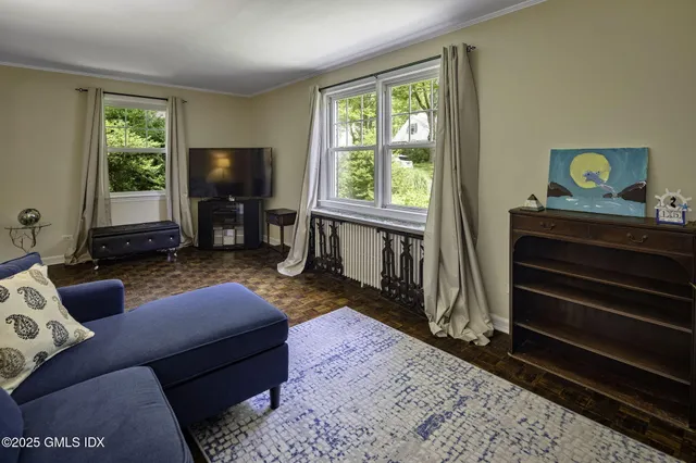 a living room with a couch and a flat screen tv