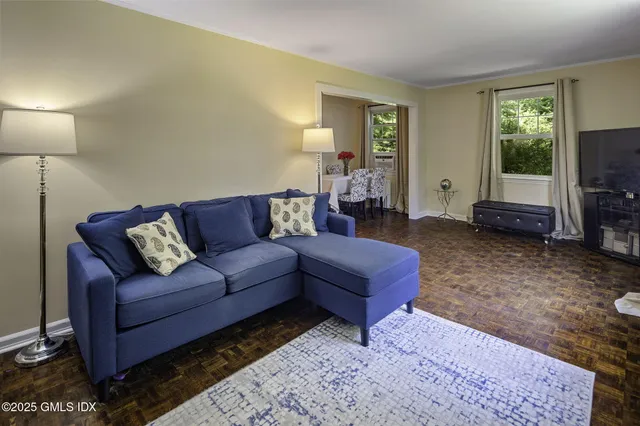 a bedroom with furniture and a window