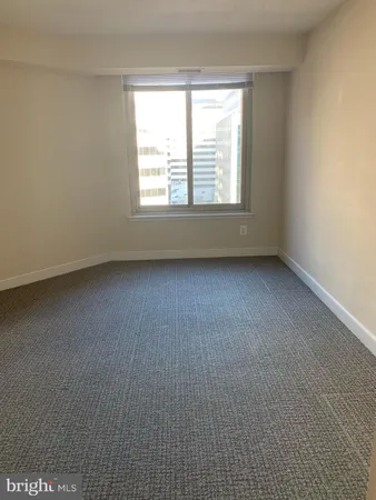 a bathroom with a granite countertop toilet sink and shower
