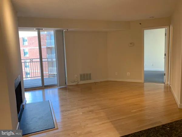 a view of an empty room and window